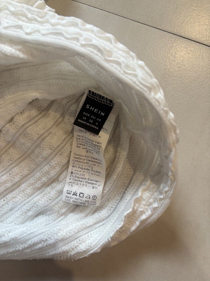 White Textured Ruched V-Neck Tank Top Size M (Category: Sleeveless) located in Manila. Submitted by sush1bae (Listing ID 1454049316, Image 3). Description: actual when worn top on pic - SHEIN white textured tank top - Features all-over ruching on the body and straps - Flattering V-neckline - Made from a comfortable polyester and elastane blend - Versatile for casual outings or dressing up.