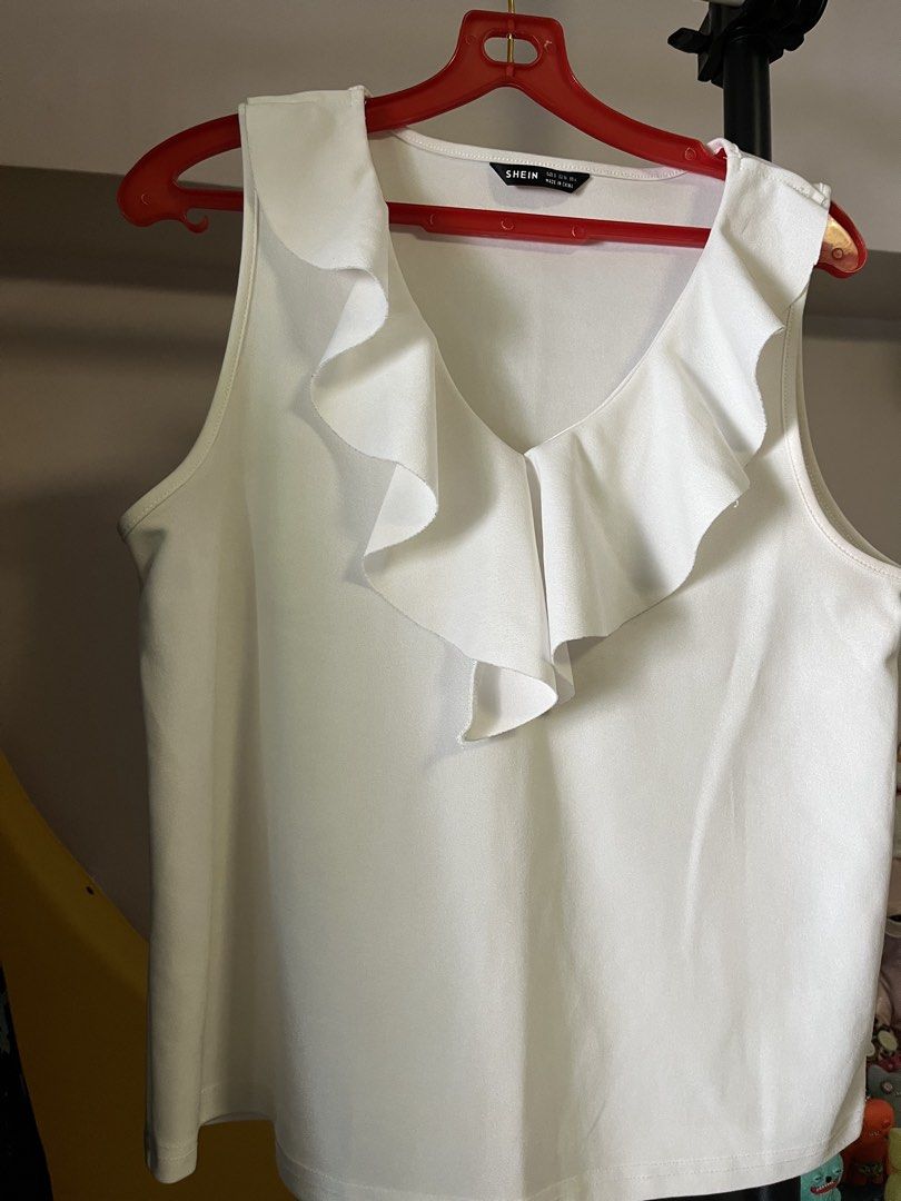 work blouse (Category: Sleeveless) located in Singapore. Submitted by mailingpreferredpls (Listing ID 1454069009, Image 1). Description: barely worn selling cheap to clear.