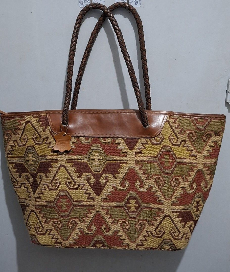 Woven Tapestry Leather Trim Tote Bag (Category: Tote Bags) located in Quezon City. Submitted by moonthrifting (Listing ID 1454038169, Image 3). Description: - Large woven tapestry tote bag - Braided leather handles and trim - Zipper closure for security - Lined with brown leather interior - Ample space for all your essentials - Ideal for everyday use or travel.