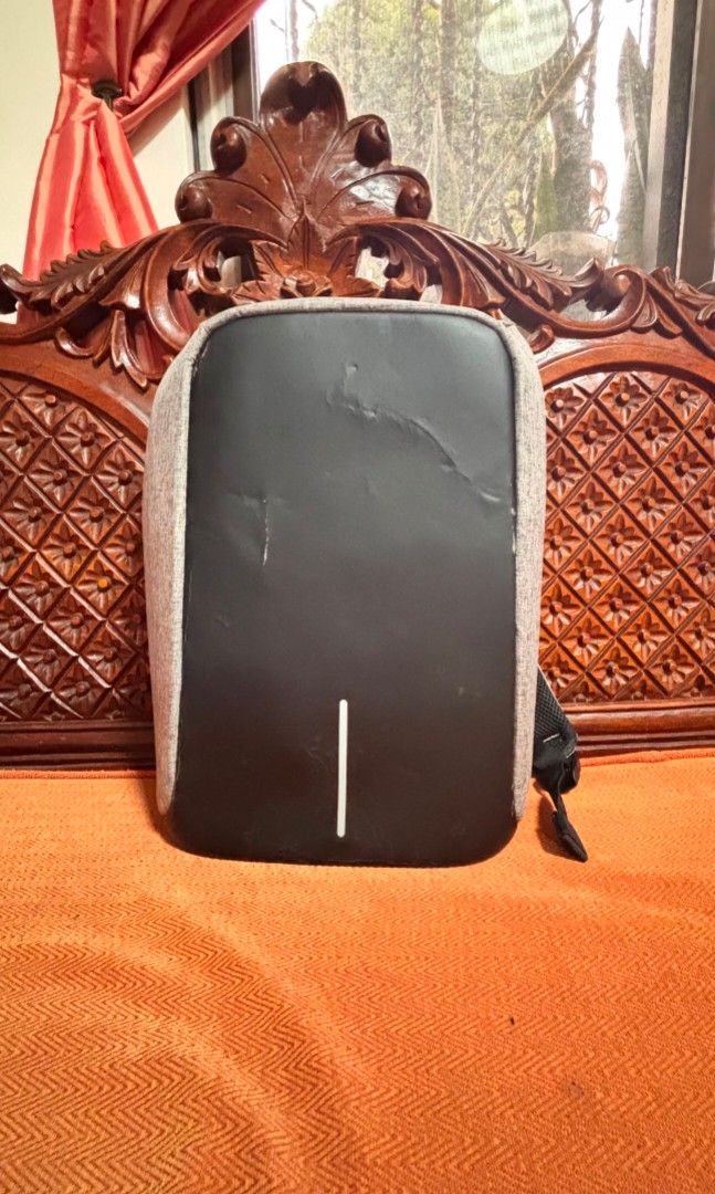 XD Design Anti-Theft Backpack (Category: Laptop Bags & Sleeves) located in Marikina City. Submitted by cutestfinds (Listing ID 1454048187, Image 1). Description: Please note that although this has never been used, there are noticeable cracks on the leather (front part of the backpack) since it has been stored for a long time. It also has a pin attached to one strap of the bag, but it can be removed. Once removed, you will see two cuts where the p