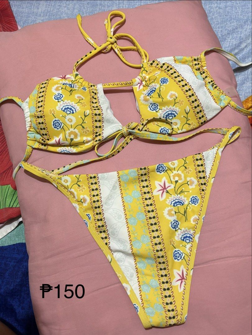 Yellow Floral Print Bikini Set (Category: Bikinis & Swimsuits) located in Pasay City. Submitted by volatile.waters (Listing ID 1454111035, Image 1). Description: - Adorable yellow bikini set - Features a fun floral and striped pattern - Halter neck top with adjustable tie closures - Matching bikini bottoms included - Ideal for beach days, pool parties, or your next vacation!.