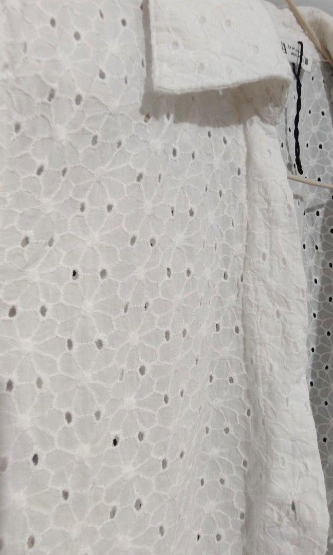 Zara White Eyelet Button-Down Dress with Belt (Category: Dresses) located in Bacoor. Submitted by qeanutdutter (Listing ID 1444566301, Image 3). Description: - Adorable white eyelet dress - Short sleeves - Button-down front - Buttons are iridescent - Can fit M to Semi-large (36in bust, 30in waist) - Length is 30inches !!! Missing 1 button.
