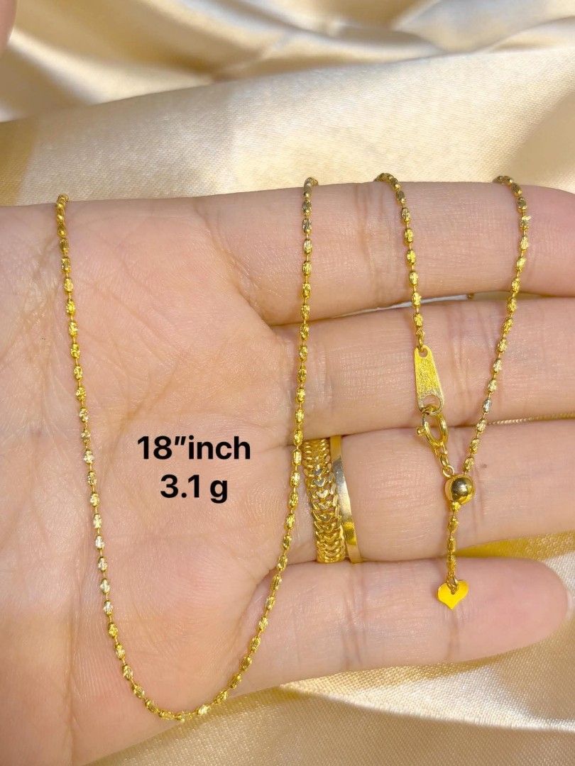 18" 3.1g Gold Chain Necklace (Category: Necklaces) located in Manila. Submitted by edzande (Listing ID 1454303706, Image 1). Description: - Delicate 18k gold chain necklace - Length: 18 inches - Weight: 3.1 grams - Features a beautiful sparkle - Adjustable clasp with a small heart charm - Ideal for everyday wear or layering.