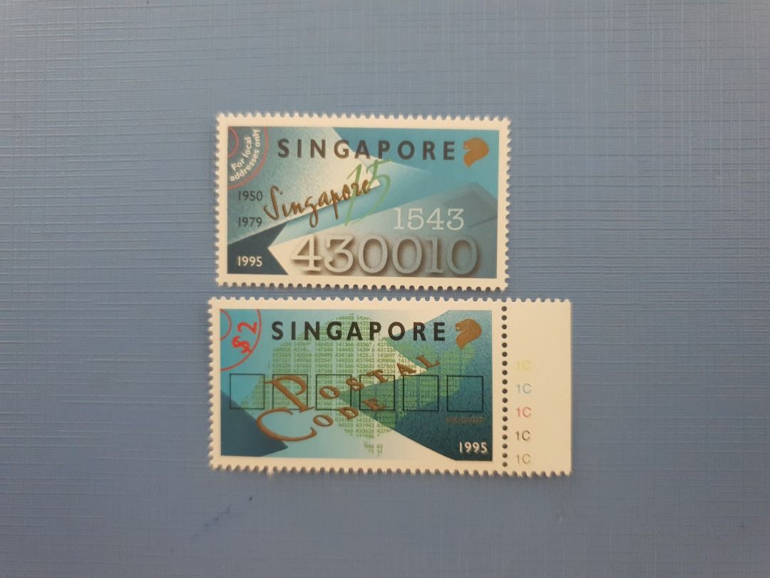 6 DIGIT POSTAL CODE (Category: Stamps & Prints) located in Singapore. Submitted by chua1432 (Listing ID 1454219119, Image 1). Description: - Set of two Singapore stamps. - Features 6-digit postal code design. - Top stamp displays 'Singapore' in script and the number '430010'. - Bottom stamp shows 'Singapore' with a grid design and '10c' denominations. - Ideal for stamp collectors and enthusiasts of Singaporean postal history..