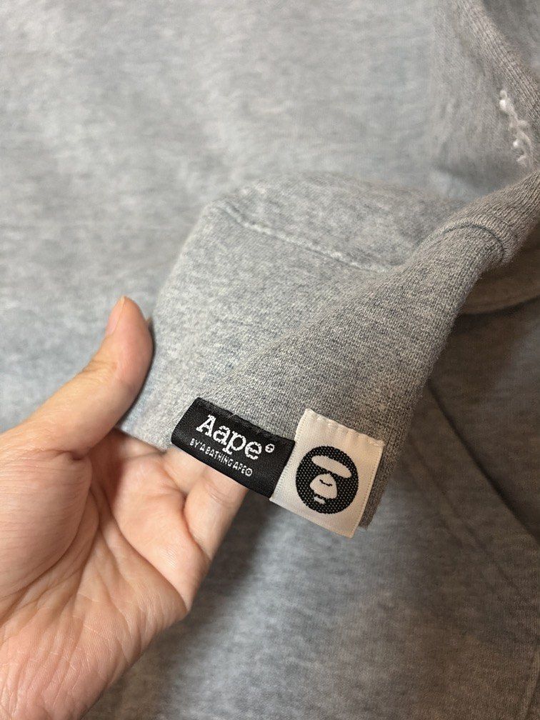 Aape Small Logo Hoodie (Category: Coats, Jackets and Outerwear) located in Quezon City. Submitted by morespace555 (Listing ID 1454273361, Image 3). Description: Personally bought this from Aape HK store 3 years ago Lost the hoodie string already Size medium mens but it shrank a little.