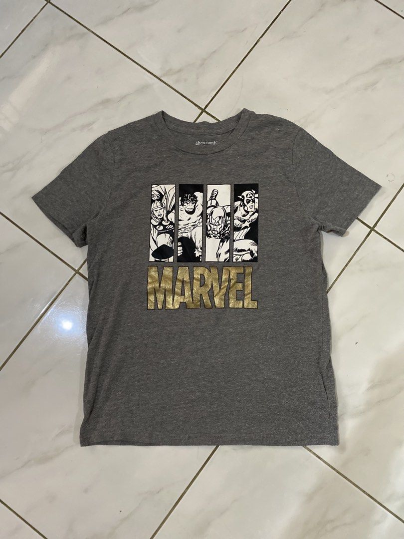 Abercrombie Marvel Graphic T-Shirt (Category: Tshirts & Polo Shirts ) located in Rizal. Submitted by channzy (Listing ID 1454228213, Image 1). Description: - Grey Abercrombie t-shirt - Cool Marvel graphic print with comic book style panels - Iconic Marvel logo in gold foil - Comfortable fabric - Size: 160/80 - Ideal for Marvel fans.
