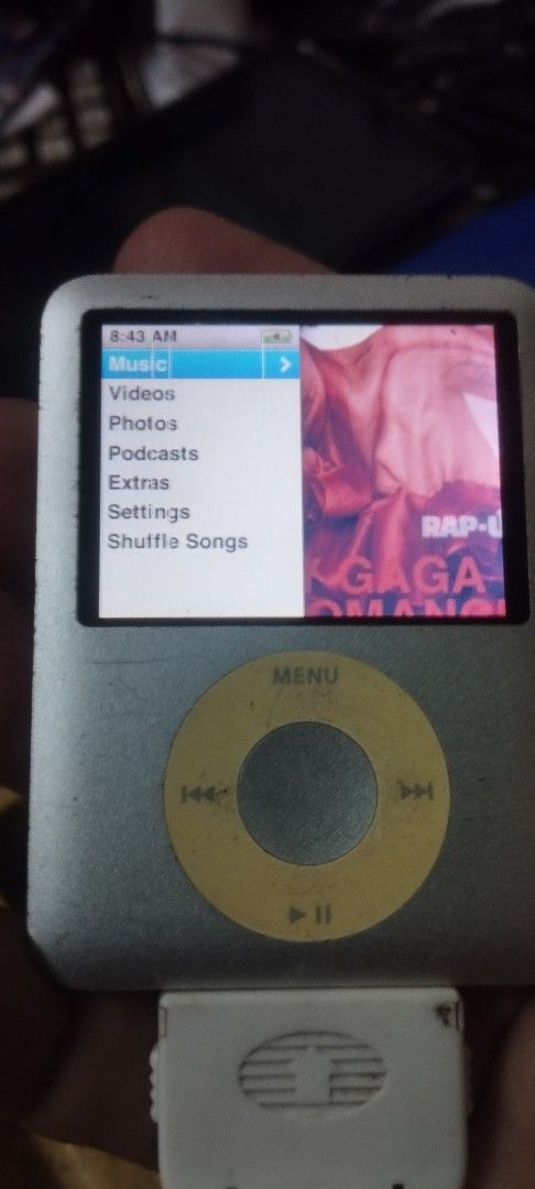 Apple iPod nano 3rd gen 8GB Silver (Category: Portable Music Players) located in Taguig. Submitted by sonnydela.cruz (Listing ID 1454364006, Image 1). Description: - Apple iPod Classic (8GB) - Ideal for storing your entire music library - Features menu options for Music, Videos, Photos, Podcasts, Extras, and Shuffle Songs - Classic Apple logo and iPod branding on the back - Casing shows some signs of wear, consistent with a beloved classic tech p