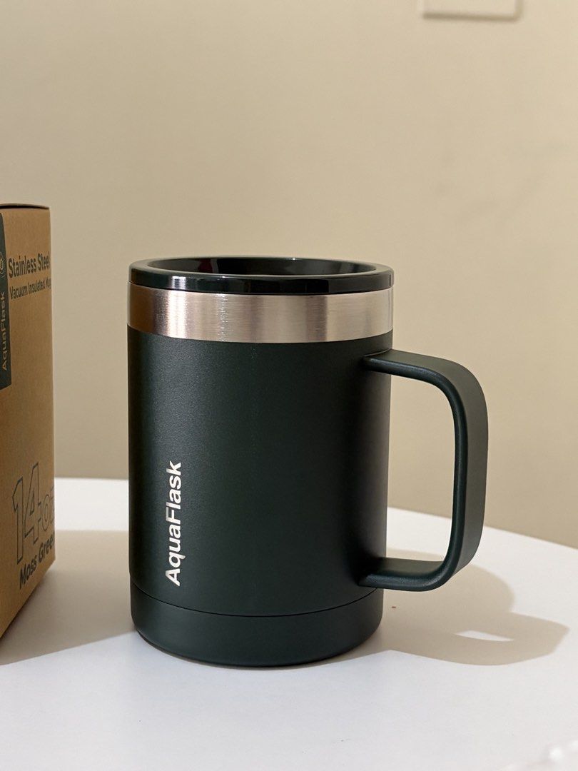 Aquaflask Insulated Mug (Category: Water Bottles & Tumblers) located in Caloocan City. Submitted by katherinep18635 (Listing ID 1454280523, Image 2). Description: - Brand: Aquaflask - Type: Insulated Mug - Color: Moss Green - Material: Stainless Steel - Feature: Vacuum Insulated - Benefit: Keeps beverages hot or cold - Condition: Brand new, comes with original box.