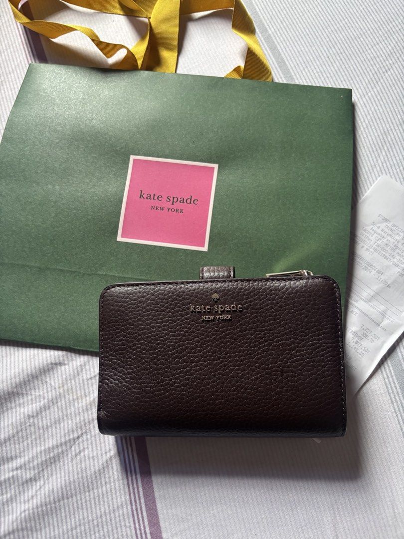 AUTHENTIC & IMPORTED Kate Spade Hot Fudge Medium Wallet (Category: Wallets & Card holders) located in Malolos. Submitted by cheerz21 (Listing ID 1454212144, Image 2). Description: Authentic & Imported Lena Kate Spade Medium Wallet Material: Pebbled Leather Color: Hot Fudge MINT Condition Barely used, good as new w/ paper bag If in doubt don’t buy. No return, no exchange. 📌 Disclaimer: Cheerz21 is not affiliated, associated, or in any way connect