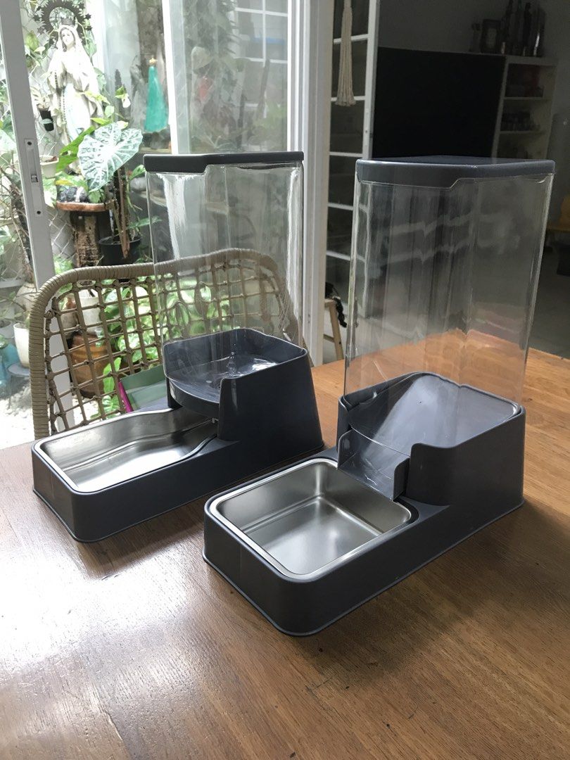 Automatic Pet Feeder and Water Dispenser Set (Category: Homes & Other Pet Accessories) located in Quezon City. Submitted by ronster (Listing ID 1454248515, Image 2). Description: - Set of 2 automatic pet feeders and water dispensers - Color: Gray with clear containers - Bowls: Stainless steel - Features: Keeps pets fed and hydrated, easy to refill - Ideal for: Cats or small dogs - Feel free to ask questions!.