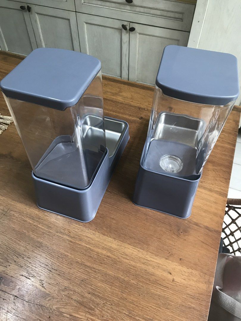 Automatic Pet Feeder and Water Dispenser Set (Category: Homes & Other Pet Accessories) located in Quezon City. Submitted by ronster (Listing ID 1454248515, Image 3). Description: - Set of 2 automatic pet feeders and water dispensers - Color: Gray with clear containers - Bowls: Stainless steel - Features: Keeps pets fed and hydrated, easy to refill - Ideal for: Cats or small dogs - Feel free to ask questions!.