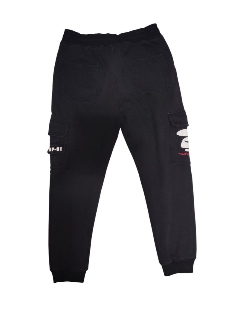 BAPE AP-01 Cargo Pants Black (Category: Jeans) located in Manila. Submitted by skaistuff (Listing ID 1454320251, Image 2). Description: - Black BAPE cargo pants (AP-01 model) - Multiple pockets, including one with a zipper - Drawstring waist for adjustable fit - Iconic ape logo detail - Ideal for everyday casual wear.