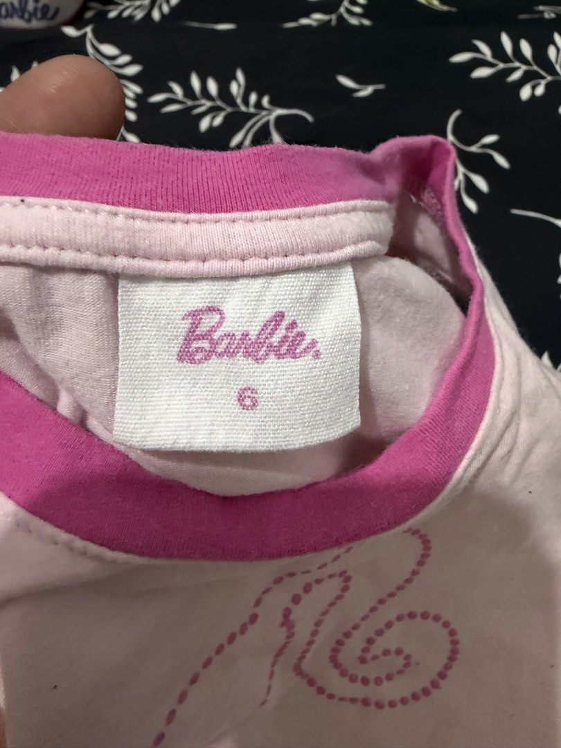Barbie Pink Tank Top Size 6 (Category: Babies & Kids Fashion) located in Angeles City. Submitted by lovedbyava (Listing ID 1454241651, Image 3). Description: - Adorable pink Barbie tank top for kids. - Features the iconic Barbie silhouette with sparkly details. - Contrasting pink trim on neckline and armholes. - Ideal for casual wear and playtime. - Size: 6.