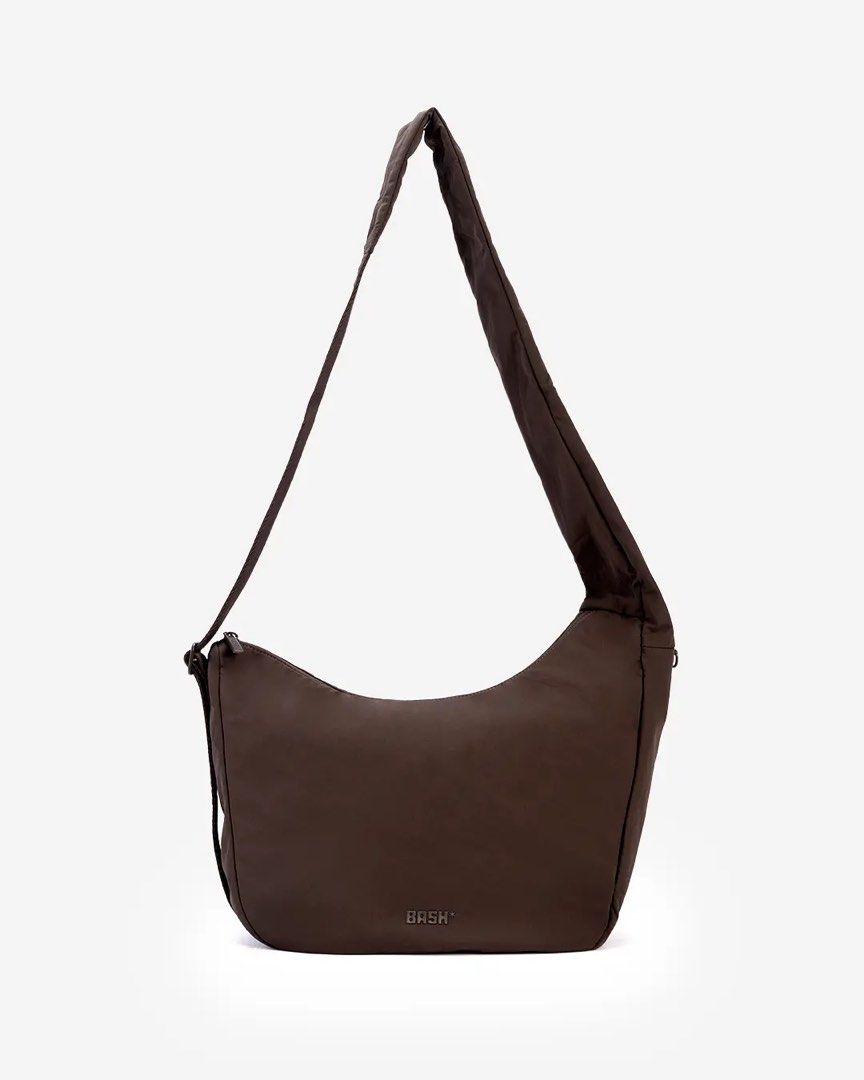 BASH* | On-The-Go Bag in Terra (Category: Cross-body Bags) located in Quezon City. Submitted by avenue.de.belle (Listing ID 1454354717, Image 3). Description: BASH* | On-The-Go Bag in Terra 🚨 Limited pieces available in limited quantities. Once sold, they’re gone. 🚨 DESCRIPTION: Designed for days that don’t follow an itinerary. The On-The-Go Bag keeps your essentials organized with multiple compartments, a dedicated passport pocket, and easy-ac