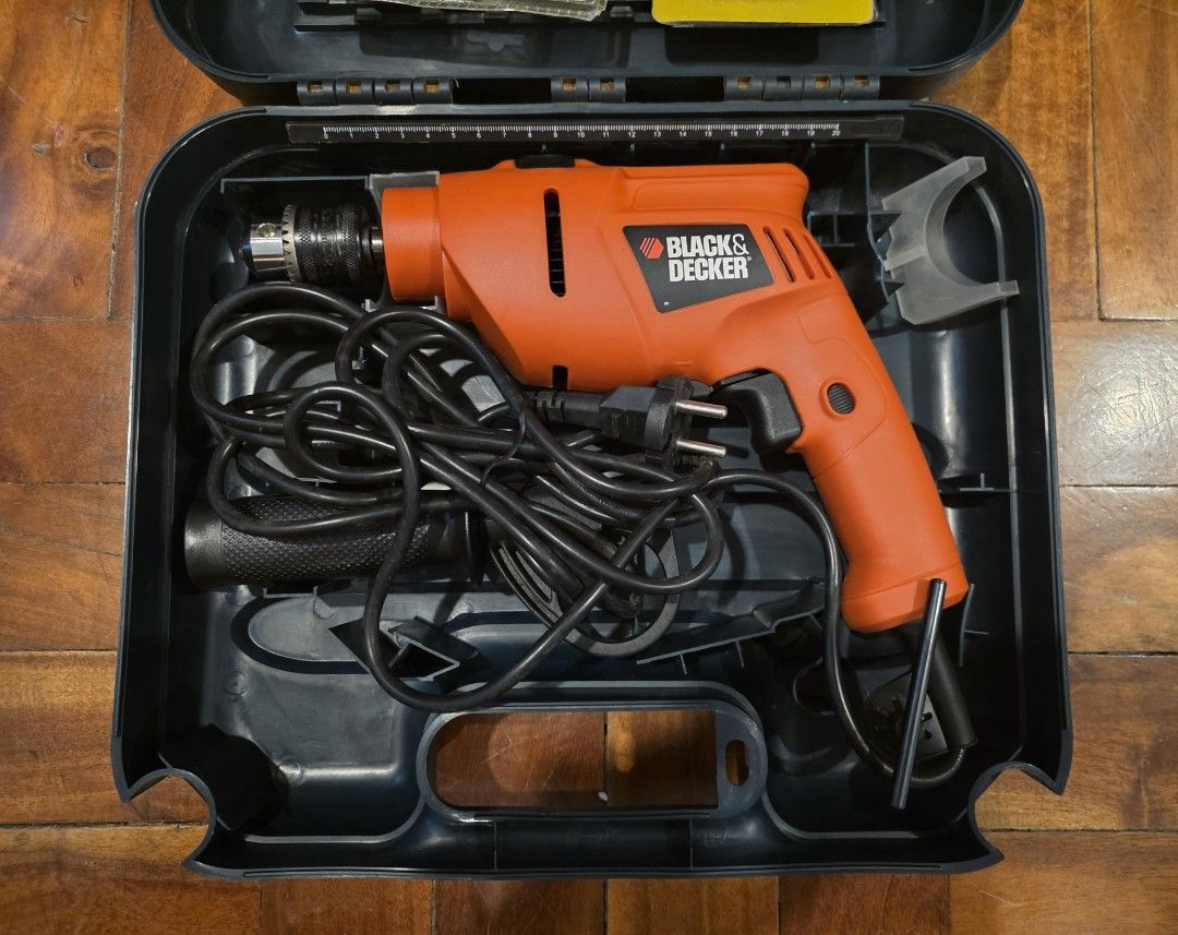 Black & Decker Electric Drill with Drill Bit Set and Case (Category: Construction Tools & Equipment) located in Pasay City. Submitted by rsar888 (Listing ID 1454271142, Image 1). Description: - Black & Decker electric drill - Includes drill bits for wood and metal - Comes with manual - Original carrying case included for easy storage and transport - corded percussion hammer drill featuring a 13mm chuck and variable speeds - Ideal for home DIY pro