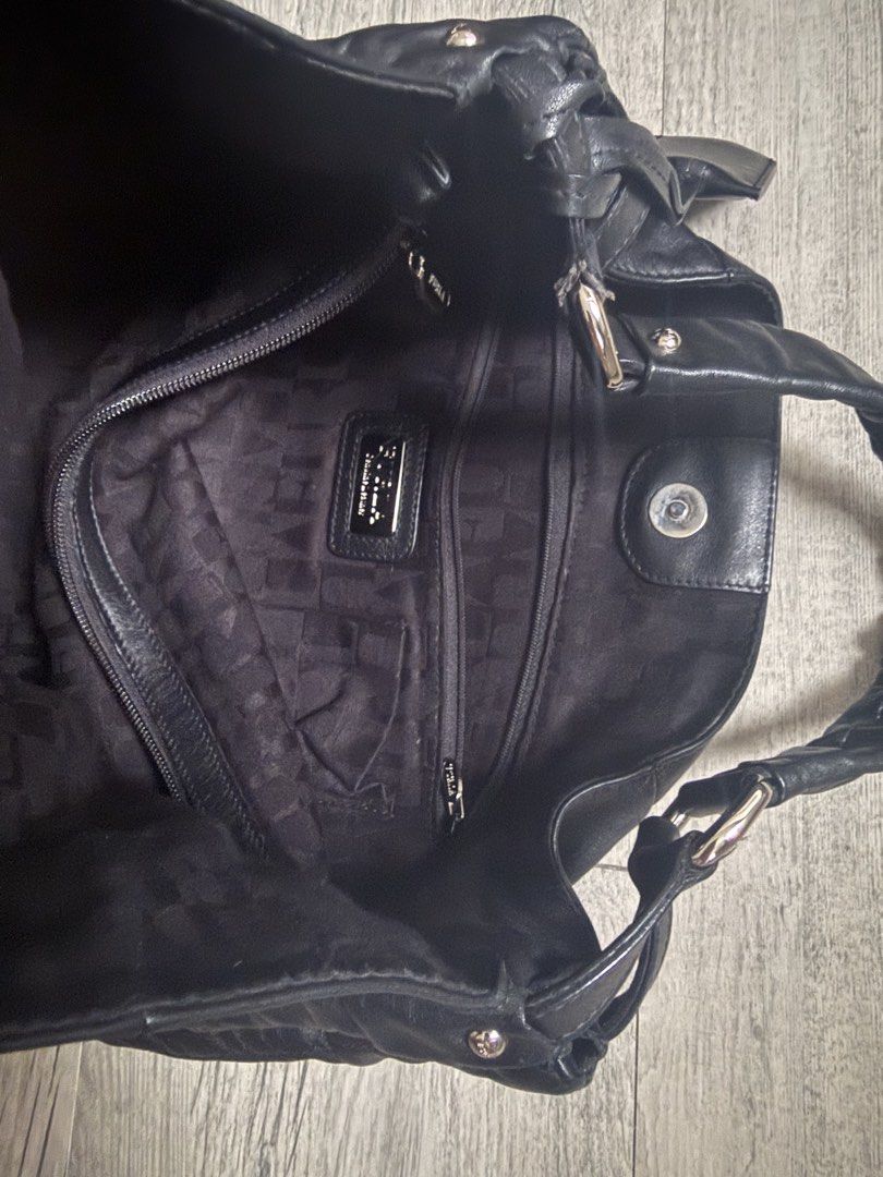 Black Leather Shoulder Bag with 'F' Logo (Category: Shoulder Bags) located in Antipolo. Submitted by 2003preloved (Listing ID 1454209381, Image 3). Description: - Soft, slouchy black leather shoulder bag - Iconic 'F' logo charm - Elegant silver hardware details - Comfortable shoulder straps - Ample interior space for essentials - Your perfect everyday companion.