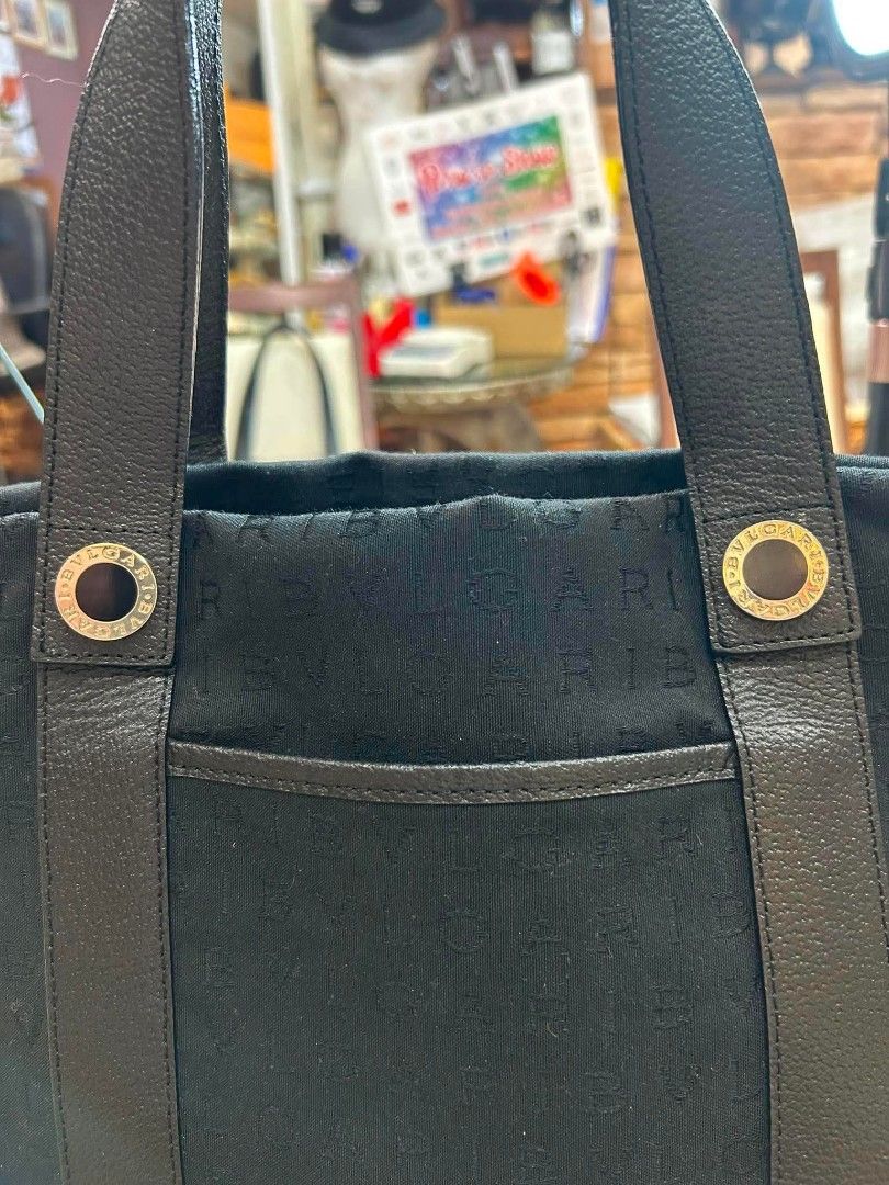 BVLGARI Black Monogram Tote Bag (Category: Tote Bags) located in Manila. Submitted by mippolin (Listing ID 1454238525, Image 3). Description: BVLGARI Black tote bag with all-over monogram pattern. Leather trim around the base. Fabric material. Good size for everyday use. Clean inside and out. Ready for a new owner..
