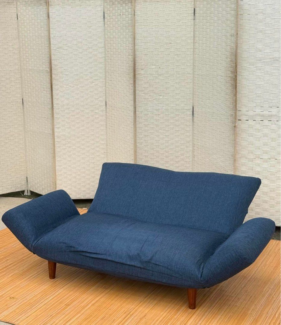 BLUE LOW SOFABED IN GOOD CONDITION (Category: Sofas) located in Manila. Submitted by jerichocal17856 (Listing ID 1454242322, Image 2). Description: JAPAN SURPLUS BLUE LOW SOFABED IN GOOD CONDITION SIZE: 12H x 55-64.5L x 22-46L W inches.
