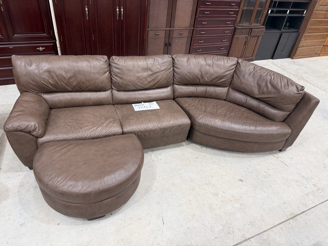 Brown Leather Sectional Sofa with Ottoman - Made in Italy (Category: Sofas) located in Manila. Submitted by furnitured (Listing ID 1454209331, Image 1). Description: - Comfortable brown leather sectional sofa - Includes matching ottoman - Made in Italy - Ideal for living rooms or lounges - Plenty of seating space - Soft and durable leather - Ready for a new home.