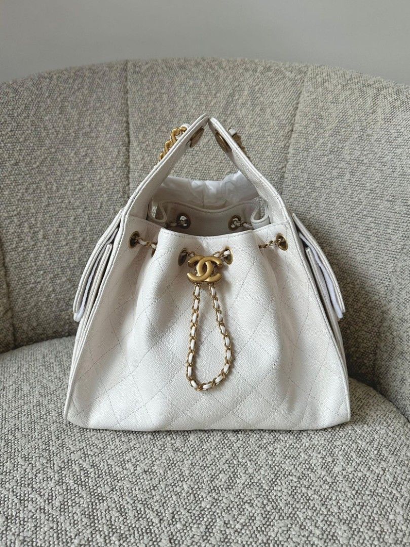 Chanel 25 White Caviar Small size Microchipped CC25 (Category: Luxury Bags & Wallets) located in Makati City. Submitted by mrsdm (Listing ID 1454217687, Image 1). Description: - Chanel 25 Drawstring Bag - Small size -Microchipped - Quilted Yellow Leather - Gold Chain Straps - Iconic CC Logo - Versatile: Great for everyday or nights out - Spacious Interior - A timeless classic for your collection.