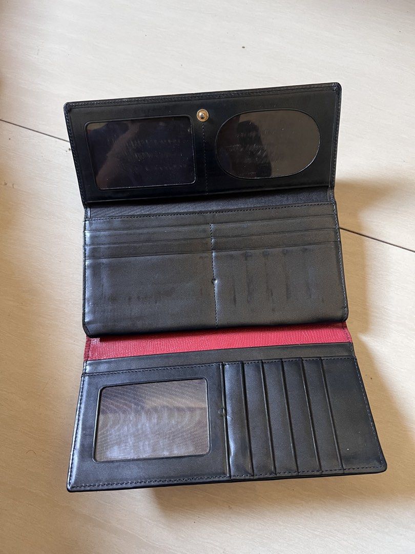 Chanel Pink Croc Embossed Long Wallet (Category: Luxury Bags & Wallets) located in Zamboanga. Submitted by safe.haimer (Listing ID 1454350213, Image 2). Description: - Chanel wallet - Pink croc embossed exterior with black trim - Black leather interior - Multiple card slots - Zip pocket - Made in France - Chanel logo zipper pull - Snap closure.