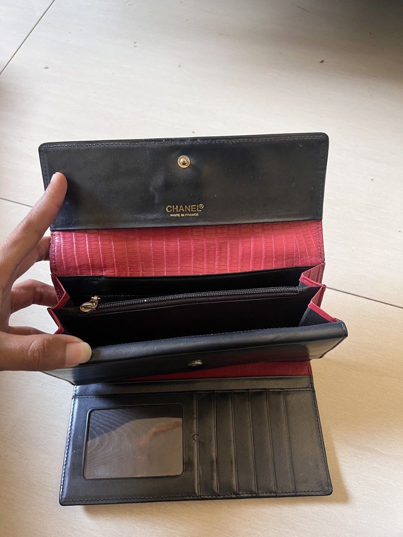 Chanel Pink Croc Embossed Long Wallet (Category: Luxury Bags & Wallets) located in Zamboanga. Submitted by safe.haimer (Listing ID 1454350213, Image 3). Description: - Chanel wallet - Pink croc embossed exterior with black trim - Black leather interior - Multiple card slots - Zip pocket - Made in France - Chanel logo zipper pull - Snap closure.
