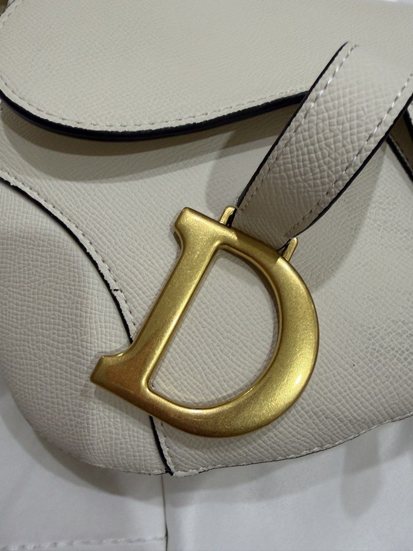Christian Dior Saddle Bag White Leather Gold Hardware (Category: Luxury Bags & Wallets) located in Pasig City. Submitted by peonyfield (Listing ID 1454318399, Image 2). Description: Comes with original dust bag.
