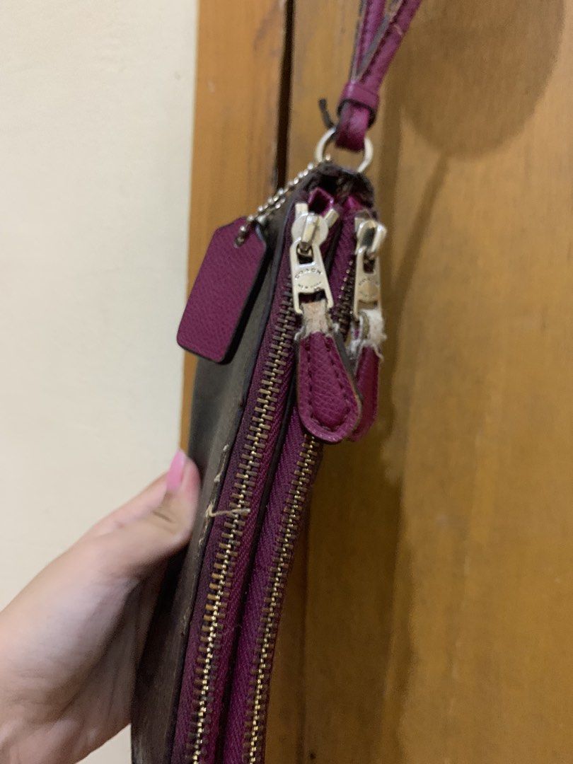 Coach Signature Canvas Double Zip Wristlet (Category: Luxury Bags & Wallets) located in Caloocan City. Submitted by necifinds (Listing ID 1454360723, Image 2). Description: - Coach wristlet in signature brown canvas - Deep purple trim and strap - Two zippered compartments for organization - Strap shows some wear and tear - Zippers are functional - check issues.