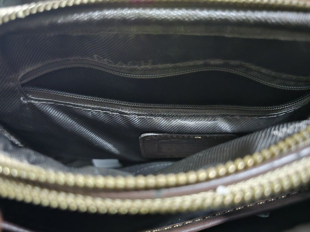 Coach Signature Monogram Crossbody Bag (Category: Luxury Bags & Wallets) located in Imus. Submitted by ur_style (Listing ID 1454311610, Image 3). Description: - Classic Coach crossbody bag - Signature monogram print (brown & tan) - Gold hardware details - Secure zipper closure - Adjustable strap for comfort - Ideal for everyday use or travel - Spacious enough for essentials.