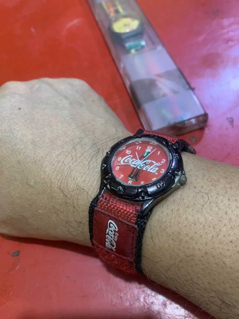 Coca-Cola Red Nylon Strap Watch (Category: Men's Watches) located in Antipolo. Submitted by cebb888 (Listing ID 1454201673, Image 3). Description: - Classic Coca-Cola watch - Features a red dial with iconic Coca-Cola bottle graphic - Red and black nylon strap with velcro closure - Comes in original packaging - Ideal for Coca-Cola fans and collectors -hard to find item / where is as is .. .