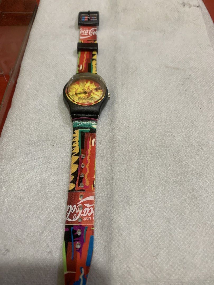 Coca-Cola Swatch Watch - Colorful Strap (Category: Men's Watches) located in Antipolo. Submitted by cebb888 (Listing ID 1454202491, Image 1). Description: - Vintage Coca-Cola watch - Vibrant, colorful strap with Coca-Cola logo - Yellow sunburst watch face with Coca-Cola branding - Perfect collectible for Coca-Cola enthusiasts - Adjustable strap -where is as is . -collectible item only .