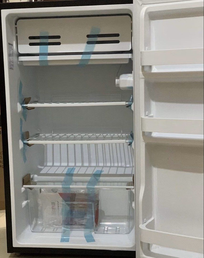 Condura Mini Refrigerator CPR93MN (Category: Refrigerators and Freezers) located in Quezon City. Submitted by pusa.ck (Listing ID 1454347273, Image 2). Description: - Condura mini fridge - Ideal for dorm rooms or small spaces - Features shelves and a crisper drawer - Interior is clean - Fully functional and working well - Ready for its new home.