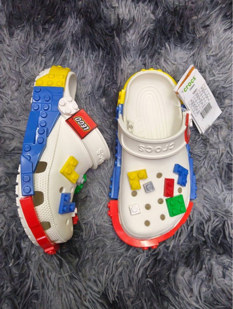 Crocs x LEGO Clogs (Category: Slippers & Slides) located in Manila. Submitted by prettyemz (Listing ID 1454340740, Image 1). Description: Lego with jibbetz Size W5 W6 W7 W8 W9 Size M7 M8 M9 M10 M11 - Authentic Crocs x LEGO collaboration - Available in White and Black - Features iconic LEGO bricks on top - LEGO logo detail on the strap - Fun, playful, and comfortable design - Ideal for kids and adult LEGO enthusiasts .