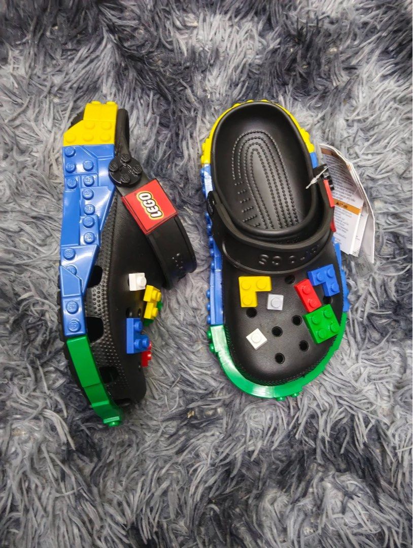 Crocs x LEGO Clogs (Category: Slippers & Slides) located in Manila. Submitted by prettyemz (Listing ID 1454340740, Image 2). Description: Lego with jibbetz Size W5 W6 W7 W8 W9 Size M7 M8 M9 M10 M11 - Authentic Crocs x LEGO collaboration - Available in White and Black - Features iconic LEGO bricks on top - LEGO logo detail on the strap - Fun, playful, and comfortable design - Ideal for kids and adult LEGO enthusiasts .