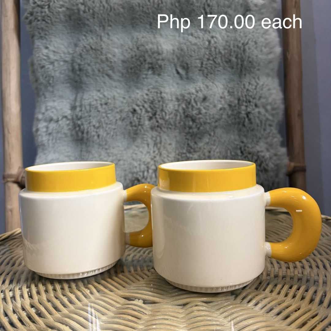 Cute Mugs with yellow handle and lining (Category: Coffee & Tea Tableware) located in Pateros City. Submitted by lovealy_07 (Listing ID 1454335111, Image 1). Description: Disclaimer – Please Read Before Ordering Our ceramic mugs are mall pull-out items. While most are in good condition, some may have minor imperfections such as: * Small dents or chips * Minor paint defects or faded print * Light scratches or factory marks.