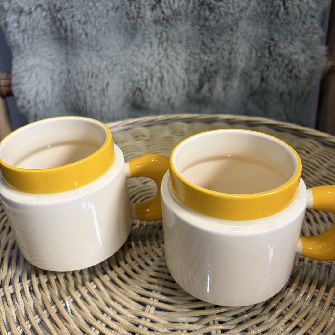 Cute Mugs with yellow handle and lining (Category: Coffee & Tea Tableware) located in Pateros City. Submitted by lovealy_07 (Listing ID 1454335111, Image 2). Description: Disclaimer – Please Read Before Ordering Our ceramic mugs are mall pull-out items. While most are in good condition, some may have minor imperfections such as: * Small dents or chips * Minor paint defects or faded print * Light scratches or factory marks.