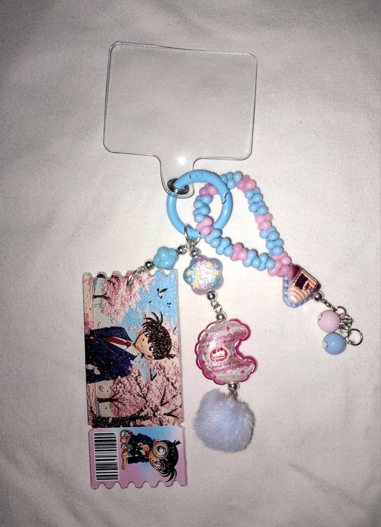 Detective Conan Keychain/Phone Charm (Category: Character Goods) located in Mexico. Submitted by moonpaihynesun07 (Listing ID 1454234132, Image 1). Description: Bring a touch of mystery and anime charm to your everyday carry with this custom Detective Conan inspired phone/keychain charm! Perfect for fans of Shinichi/Conan.