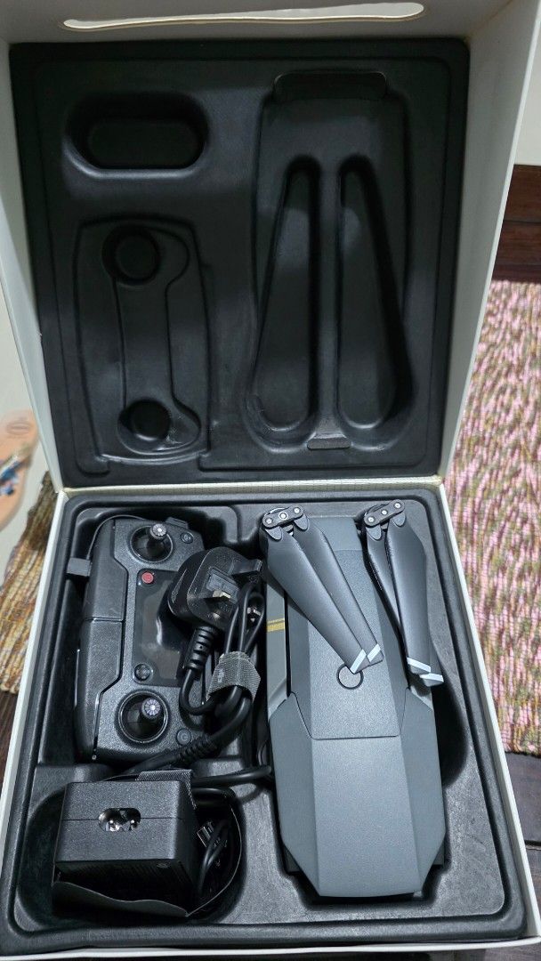DJI Mavic Pro Drone with Controller and Accessories (Category: Drones) located in Baguio. Submitted by timmy_son (Listing ID 1454194050, Image 2). Description: - DJI Mavic Pro Drone - Includes: Controller, Charger, Extra Propellers - Original packaging included - Ideal for aerial photography & videography -napalitan battery -like new pa naman -nag-oon pero hindi q alam paano paliparin - buy as is.
