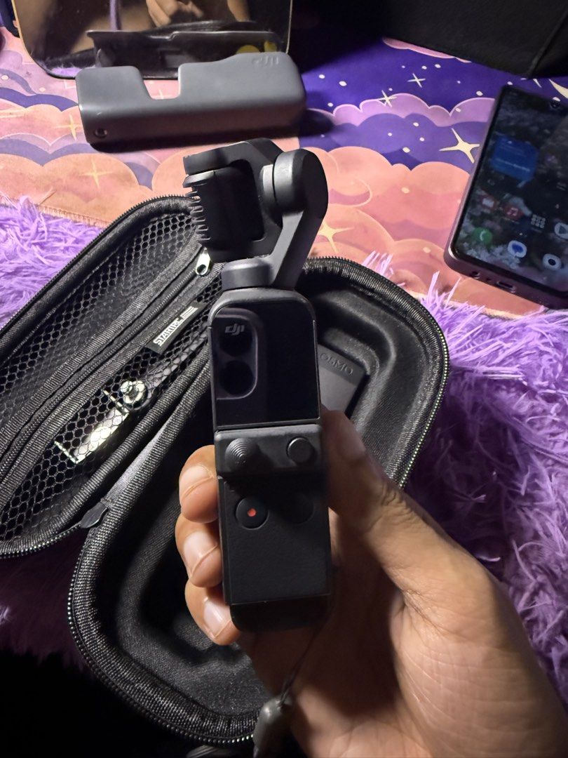 DJI OSMO POCKET 2 (Category: Video Cameras) located in Manila. Submitted by rcii09 (Listing ID 1454271003, Image 2). Description: DJI OSMO POCKET 2. Inclusion: Hard case 128 SD CARD BATTERY STAND.