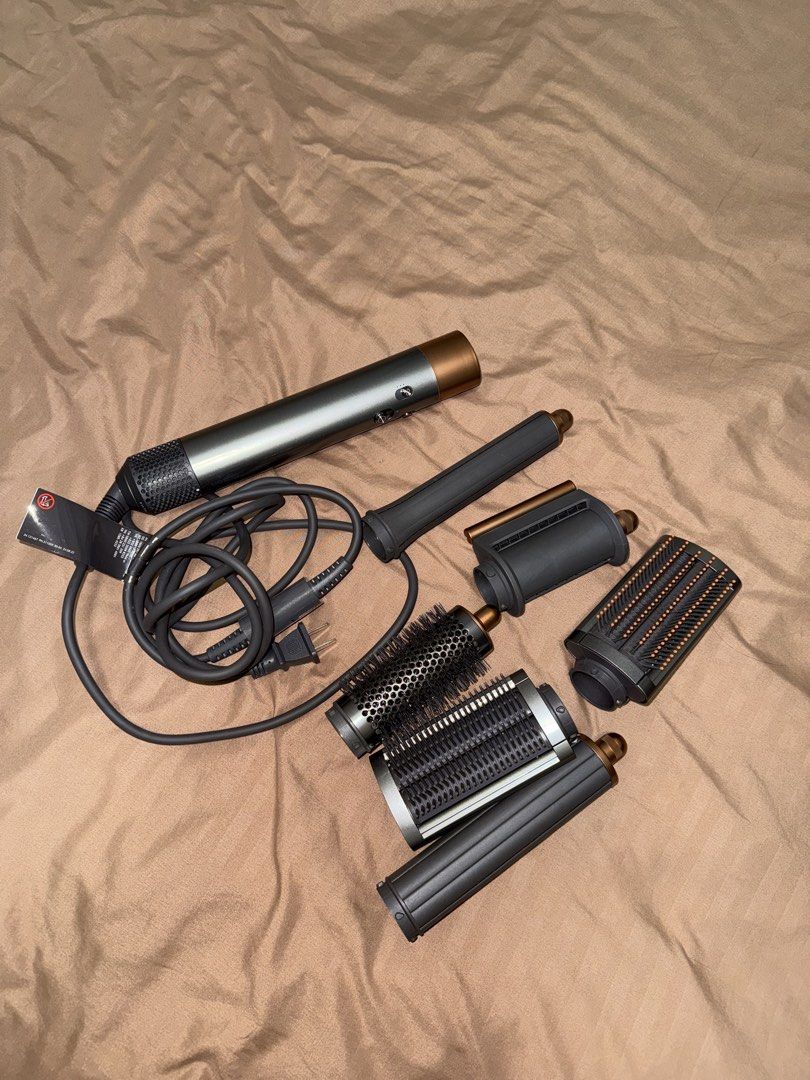 Dyson Airwrap Complete Long (Category: Hair) located in Manila. Submitted by agathamlnt56832 (Listing ID 1454220436, Image 3). Description: - Dyson Airwrap Complete Long - Includes all barrels and brushes - Comes with original storage case - Used only a few times - Ideal for fast and effortless hair styling.