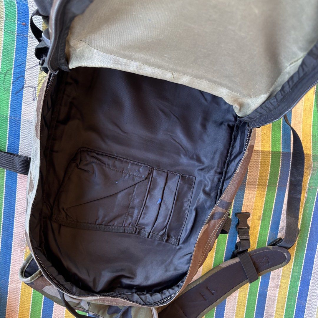 Eastpak Camouflage Backpack (Category: Backpacks) located in Banga. Submitted by akosiloco (Listing ID 1454194612, Image 3). Description: - Stylish Eastpak backpack with a cool camouflage print. - Multiple front pockets for quick access to essentials. - Spacious main compartment featuring an internal organizer pocket. - Comfortable padded shoulder straps for easy carrying. - Ideal for school, work, or everyday adventures..