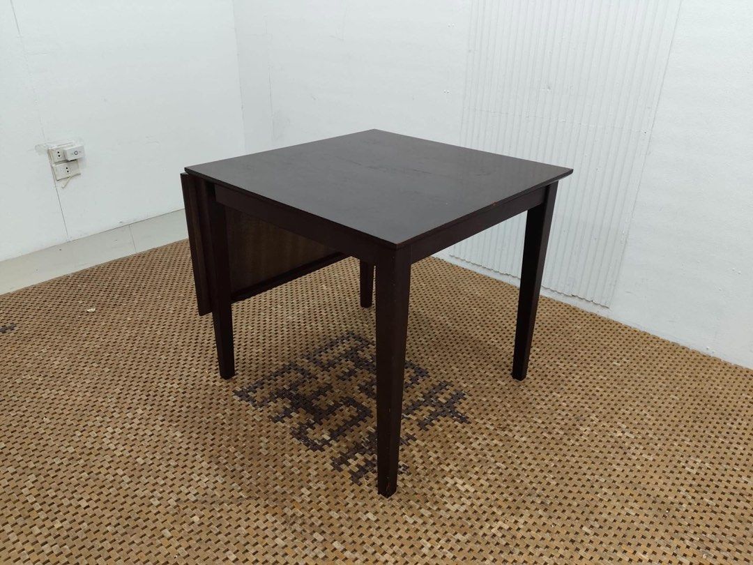 Expandable dining table (Category: Tables & Sets) located in Quezon City. Submitted by matetdevis13 (Listing ID 1454220227, Image 2). Description: Expandable Wooden 2-4 Seater Dining Table Price: 5,500 L47/29.5 x W29.5 x H27.5 In good condition Code JMD15-MJ415.