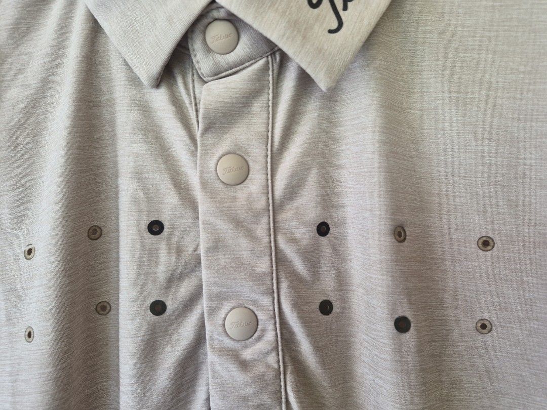 Fitleist Golf Polo Shirt Size L Beige (Category: Tshirts & Polo Shirts ) located in Davao. Submitted by rodrigoani57168 (Listing ID 1454310032, Image 3). Description: - Titleist Golf Polo Shirt - Size: Large (L) - Color: Beige with black shoulder accents - Features Titleist logo on the collar - Made from breathable fabric, ideal for golf - Button placket - Perforated chest area for enhanced ventilation - No issue -Color Rate 10/10 -Dimes: inches 