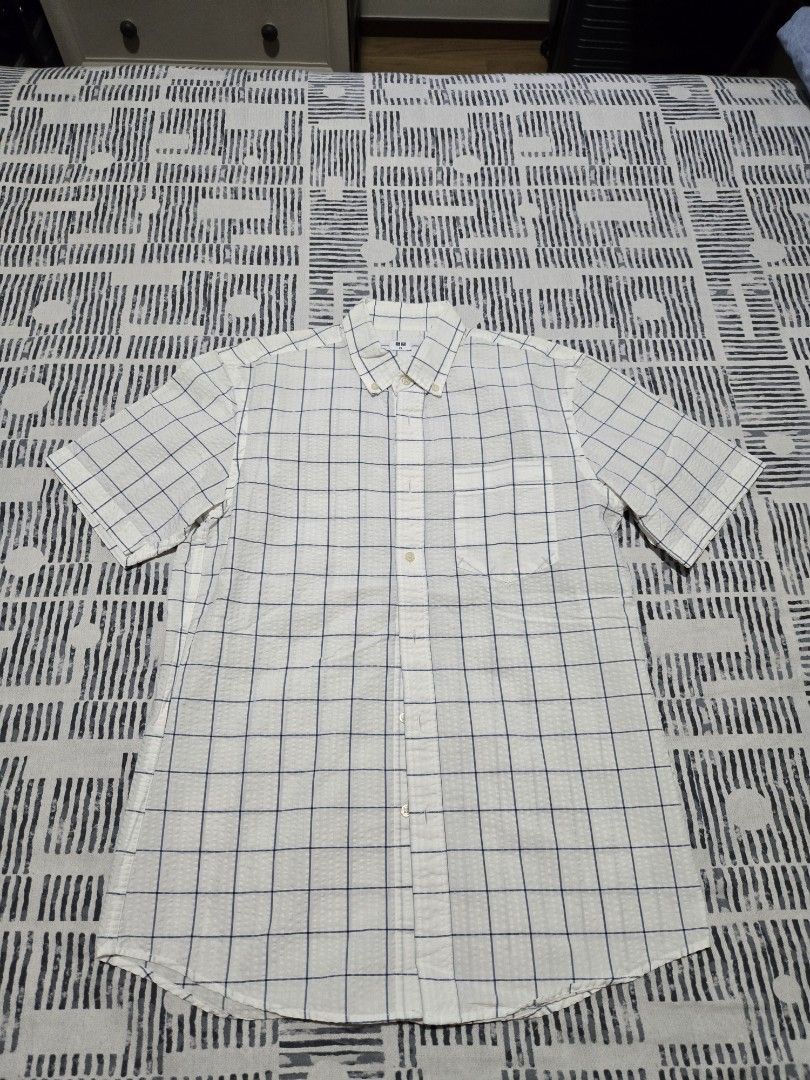 Gap Polo Shirt (Category: Coats, Jackets and Outerwear) located in Quezon City. Submitted by mgdeclutters (Listing ID 1454193268, Image 2). Description: - Brand: Gap - Type: Short Sleeve Polo Shirt - Size: XS (EU 46/UK 36/US 36) - Color: White with blue grid pattern - Condition: Good, pre-loved - Style: Casual, classic.