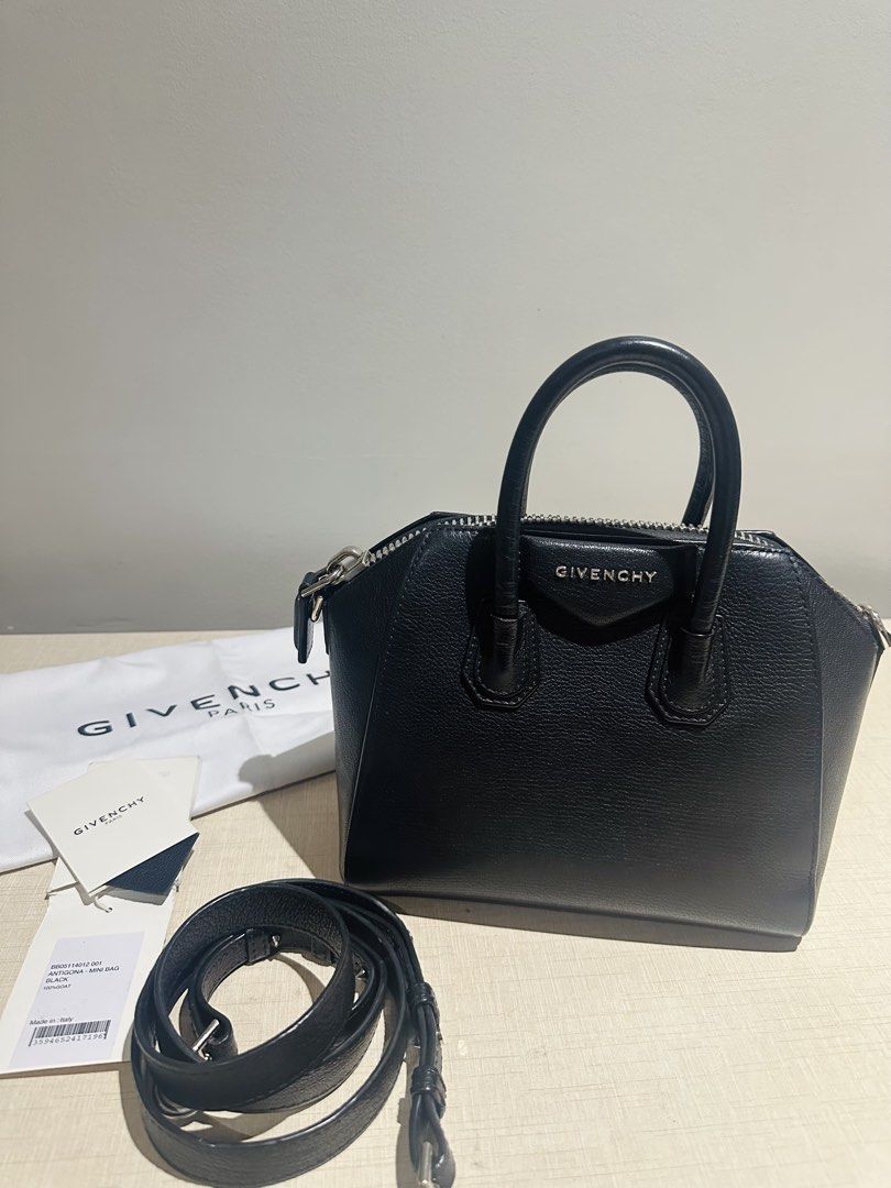 Givenchy Mini Antigona (Category: Luxury Bags & Wallets) located in Mandaluyong City. Submitted by archrach (Listing ID 1454275745, Image 1). Description: Preloved in very good condition; selling low for only P35k only; current retail value at $2100 plus taxes (see last photo from website) Mini handbag or crossbody bag in 100% black grained goatskin leather. Classic Antigona line; Zipper closure with GIVENCHY 4G zipper pull. Signature Pentagonal 