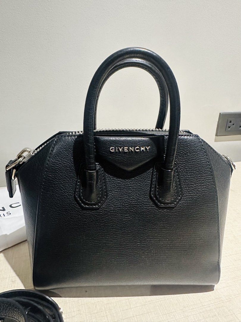 Givenchy Mini Antigona (Category: Luxury Bags & Wallets) located in Mandaluyong City. Submitted by archrach (Listing ID 1454275745, Image 2). Description: Preloved in very good condition; selling low for only P35k only; current retail value at $2100 plus taxes (see last photo from website) Mini handbag or crossbody bag in 100% black grained goatskin leather. Classic Antigona line; Zipper closure with GIVENCHY 4G zipper pull. Signature Pentagonal 