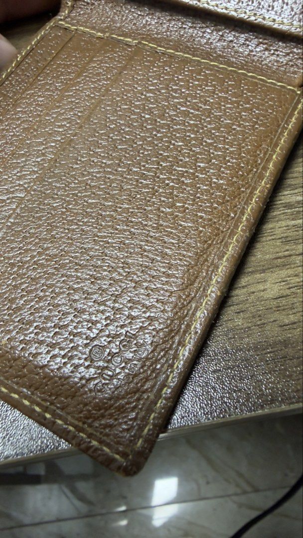 Gucci GG Monogram Canvas Bi-fold Wallet (Category: Luxury Bags & Wallets) located in Baguio. Submitted by fndrskprskid (Listing ID 1454348930, Image 2). Description: - Authentic Gucci wallet - Classic GG monogram canvas - Brown leather trim and interior - Bi-fold design with card slots and compartments - Timeless accessory.