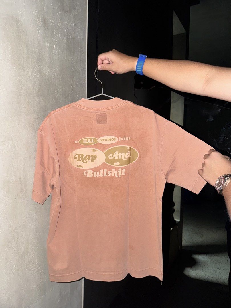 HAL STUDIOS Rap And Bullshit T-Shirt Size S (Category: Luxury Apparel) located in Manila. Submitted by rb.declutters (Listing ID 1454345889, Image 2). Description: - Brand: HAL STUDIOS - Graphic: 'Rap And Bullshit' on back - Color: Dusty Rose / Terracotta - Size: S - Style: Casual wear.