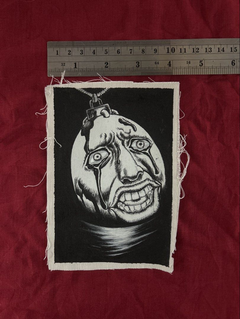 Hand painted patch of Behelit from Berserk (Category: Art & Prints) located in Plaridel. Submitted by eraxer___x___xtain (Listing ID 1454219317, Image 3). Description: •This image features a detailed, hand-drawn black and white textile patch of a Beherit from the Berserk manga series. •Medium is Jacquard Textile Paints .