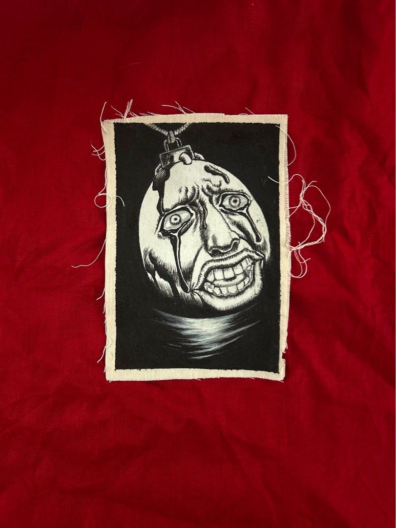 Hand painted patch of Behelit from Berserk (Category: Art & Prints) located in Plaridel. Submitted by eraxer___x___xtain (Listing ID 1454219317, Image 1). Description: •This image features a detailed, hand-drawn black and white textile patch of a Beherit from the Berserk manga series. •Medium is Jacquard Textile Paints .